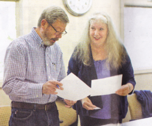 Anne Andler visits with Dick Eyde, secretary for Villages NW, before a meeting at the Elsie Stuhr center in Beaverton.